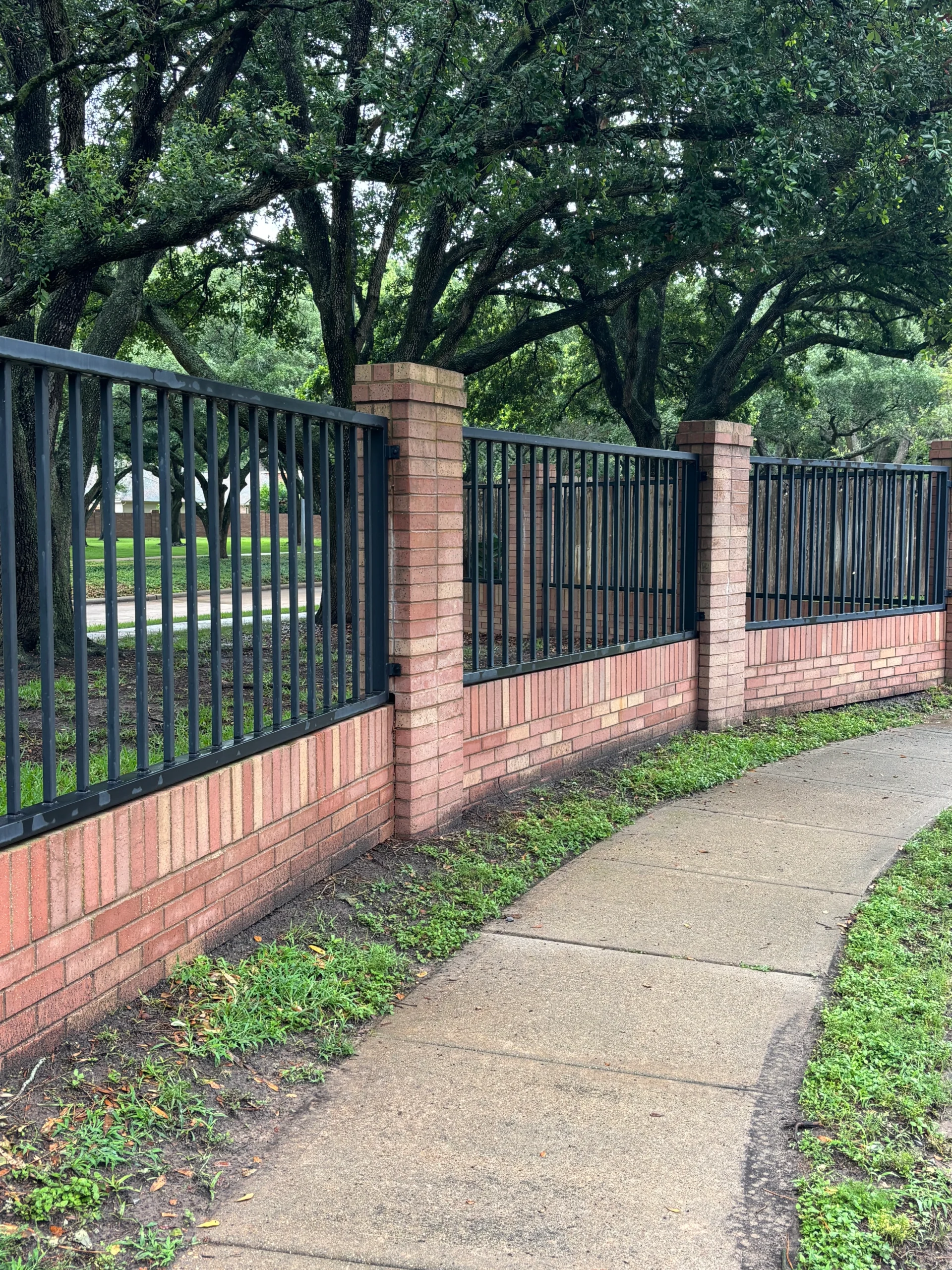 Steel fence repair in Austin TX showing repaired metal fence section